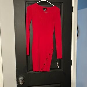 Red sweater dress with gold details on bottom